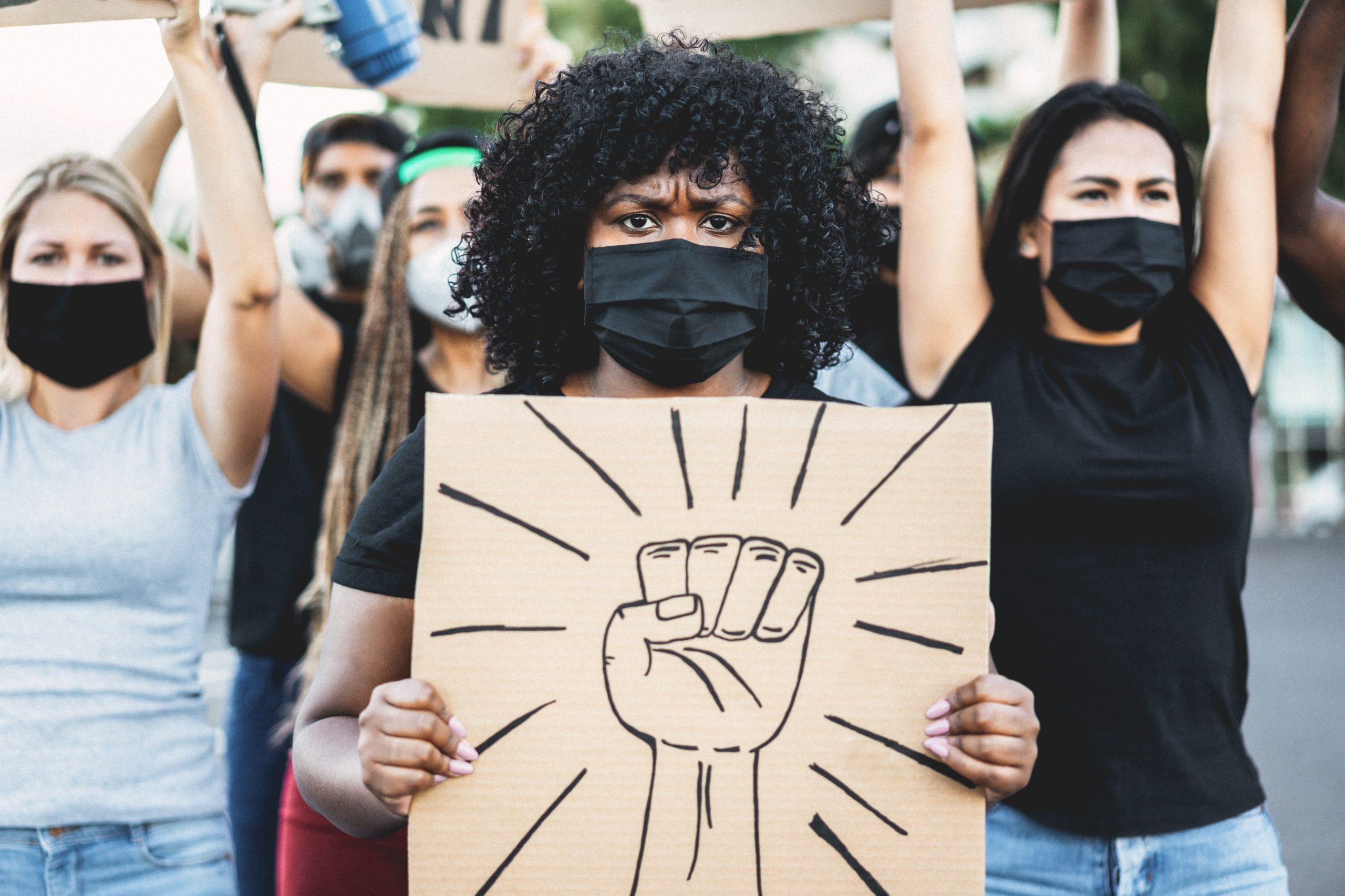 Diverse young people participating in public advocacy